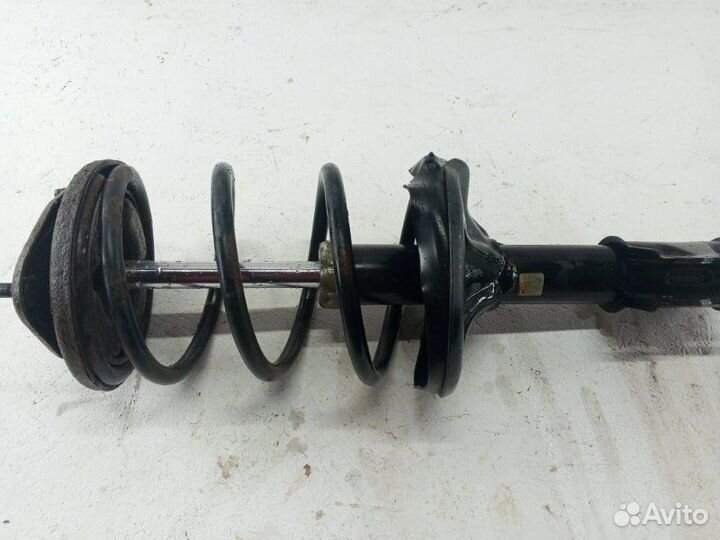 Амортизатор стойка передний левый Mitsubishi