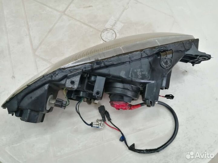 Фара Mitsubishi Colt левая CJO