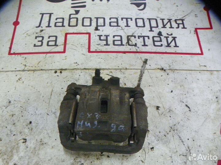 Суппорт тормозной задний левый Mazda CX-7