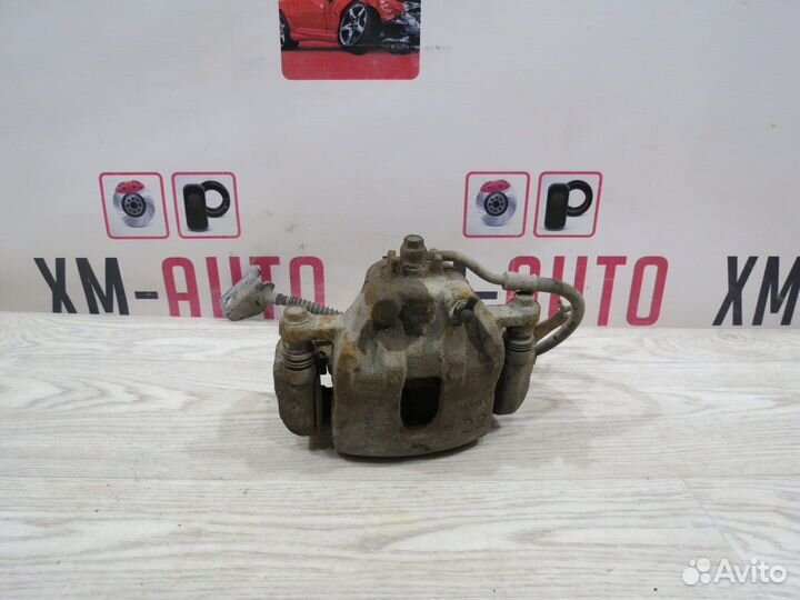 Суппорт тормозной передний левый Kia Rio 3