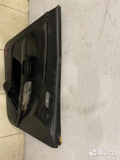 Обшивка двери передняя левая Geely Emgrand EC7