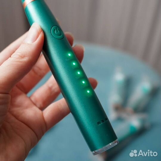 Электрическая зубная щетка