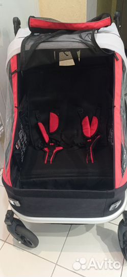 Велосипедный прицеп для двоих детей