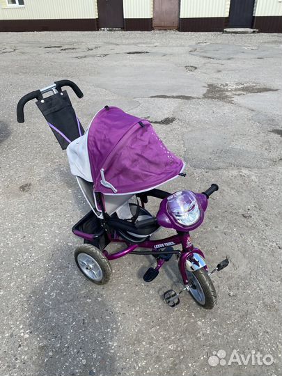 Трехколёсный велосипед с ручкой