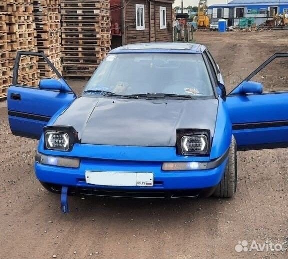 В разборе слепая Mazda 323f BG