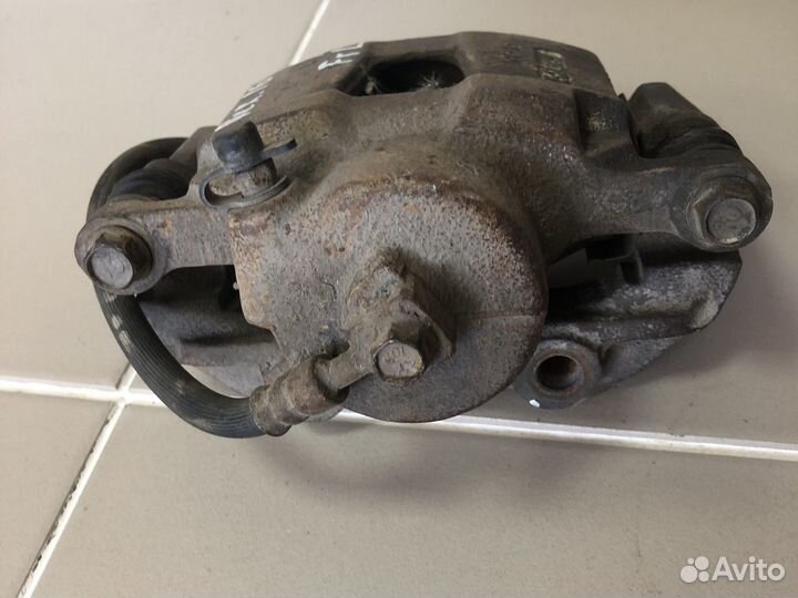 Суппорт тормозной левый R14 Daewoo Nexia