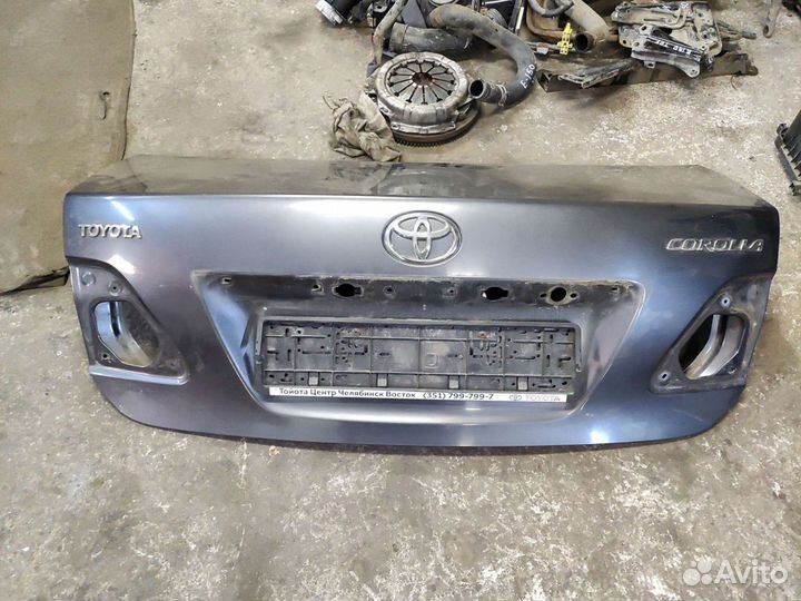 Эмблема багажника Toyota Corolla e 150