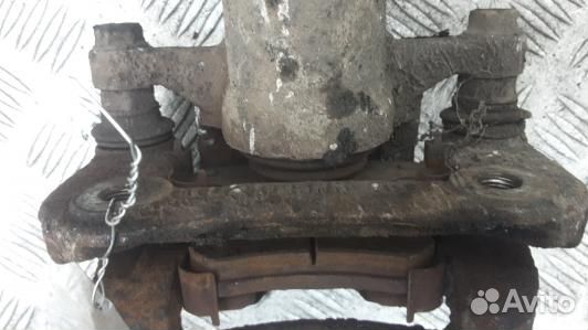 Суппорт тормозной задний левый KIA sportage 3 (HNT