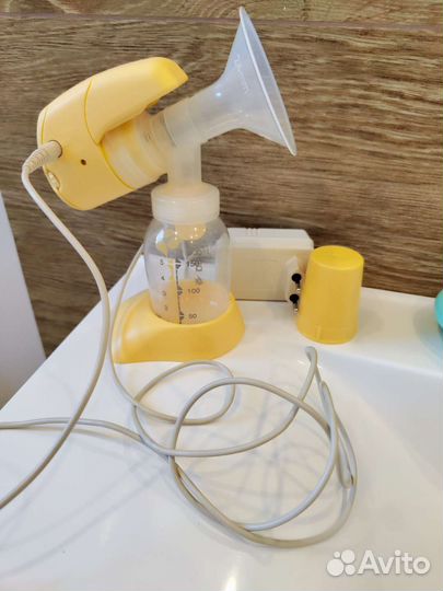 Молокоотсос medela электрический
