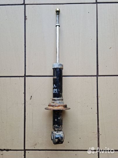 Стойка амортизатор задний Mitsubishi Lancer IX