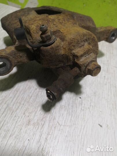 Суппорт передний левый Шевроле Ланос