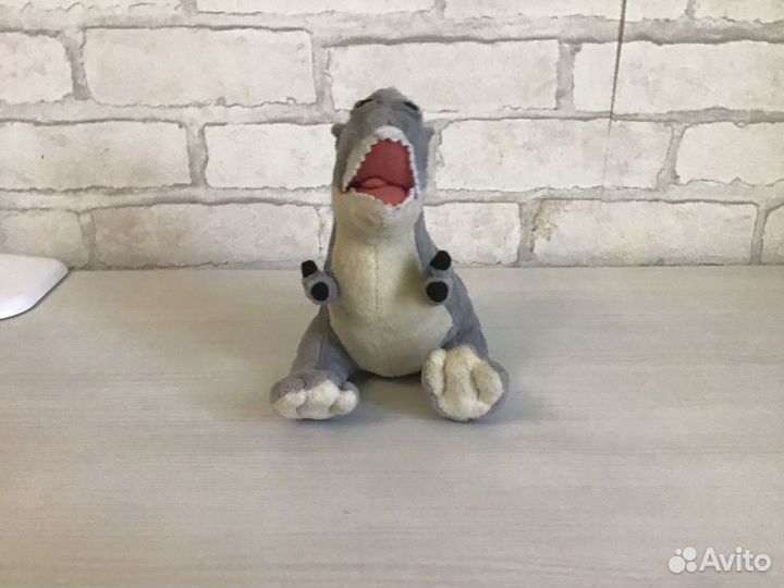 Плюшевый игрушечный динозавр