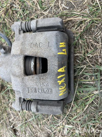 Тормозной суппорт Daewoo Nexia передний