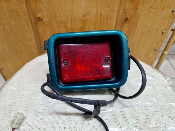 Фонарь противотуманный задний левый Mazda Demio DW