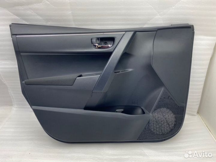 Обшивка двери передняя левая Toyota Corolla