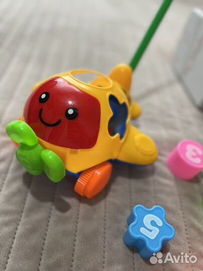 Игрушки каталки пакетом для малыша