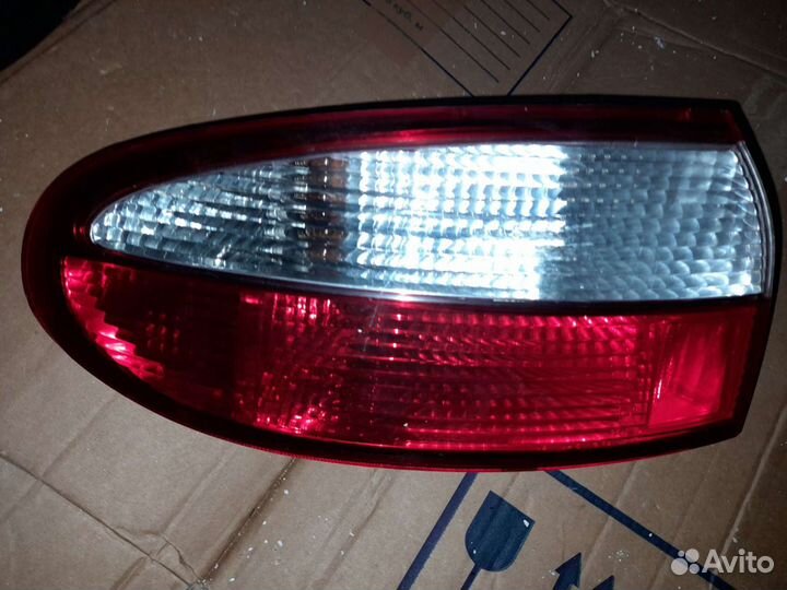 Фонарь задний наружный на chevrolet lanos (2004)