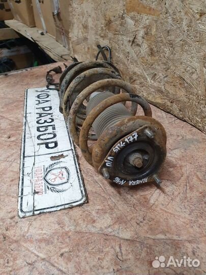 Амортизационная стойка передняя левая с пружиной 1