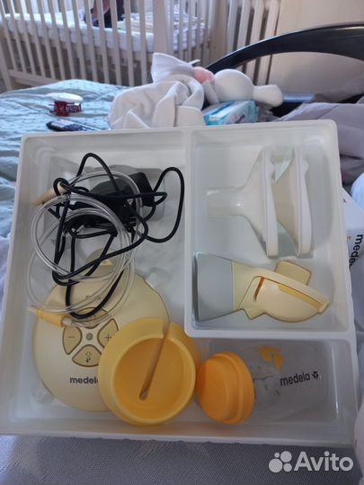 Молокоотсос medela электрический новый