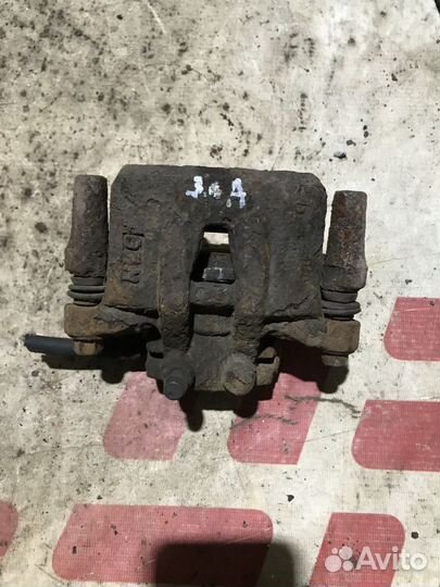 Суппорт тормозной задний Mitsubishi Outlander II р