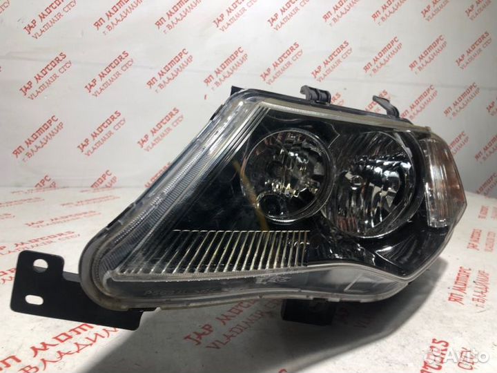 Фара галогеновая левая Mitsubishi Outlander XL