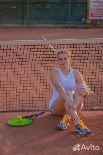 Тренер по большому теннису