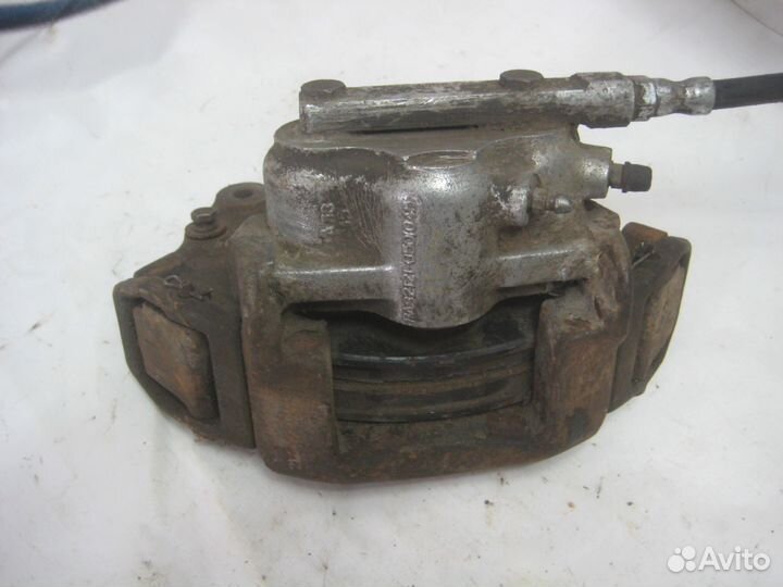 Суппорт тормозной передний лев Chevrolet Niva