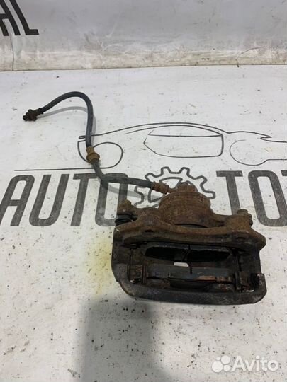 Суппорт передний правый Nissan Almera Classic B10