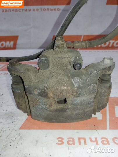 Суппорт тормозной передний левый Nissan Teana J32