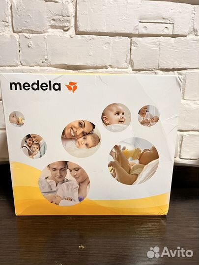 Молокоотсос medela электрический