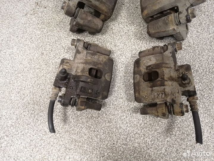 Суппорт тормозной задний Mitsubishi Outlander CU