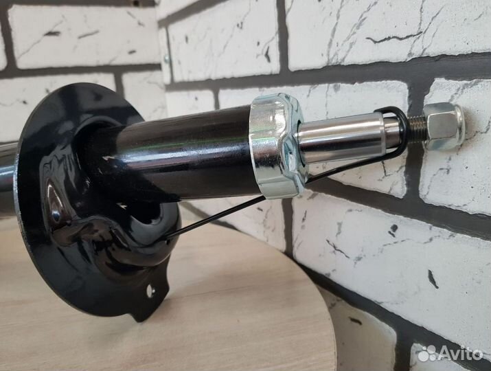 Амортизатор с ABS шевроле перед. левый оригинал