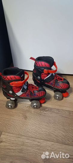 Роликовые регулируемые коньки