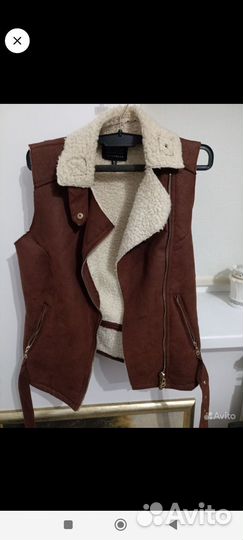 Жилеты теплые женские