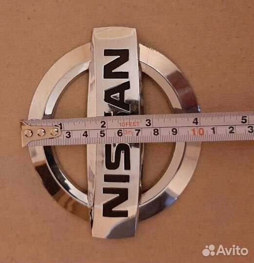 Эмблема Nissan