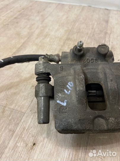 Суппорт задний левый Mitsubishi Lancer 10 CY3A