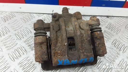 Суппорт тормозной задний левый KIA RIO 2 (XBN17LS0