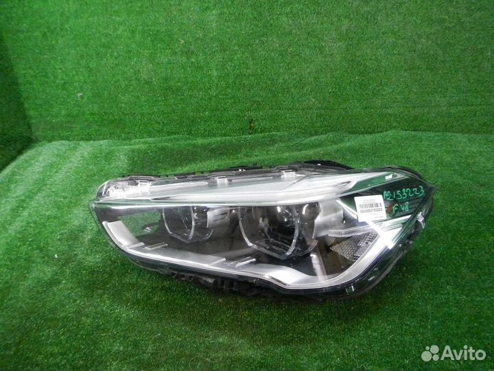 Фара левая BMW X1