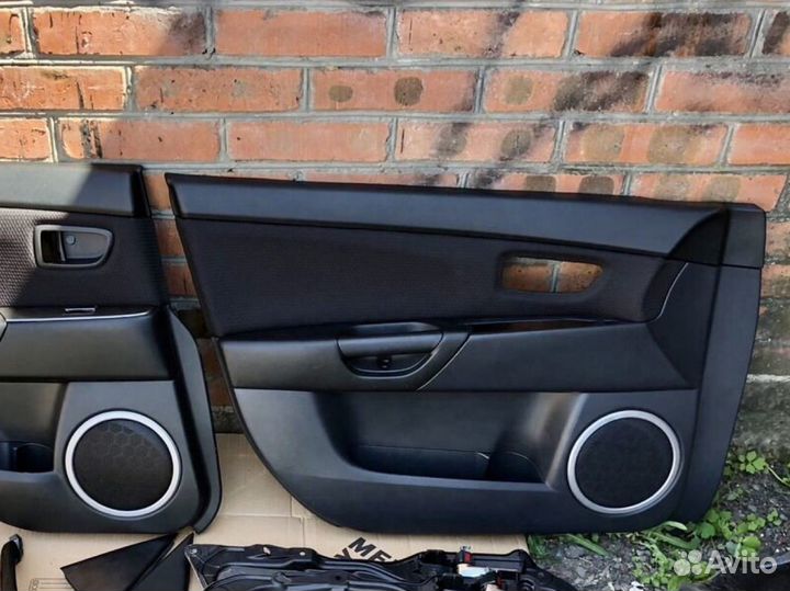 Обшивки дверей Mazda 3 bk 2007г