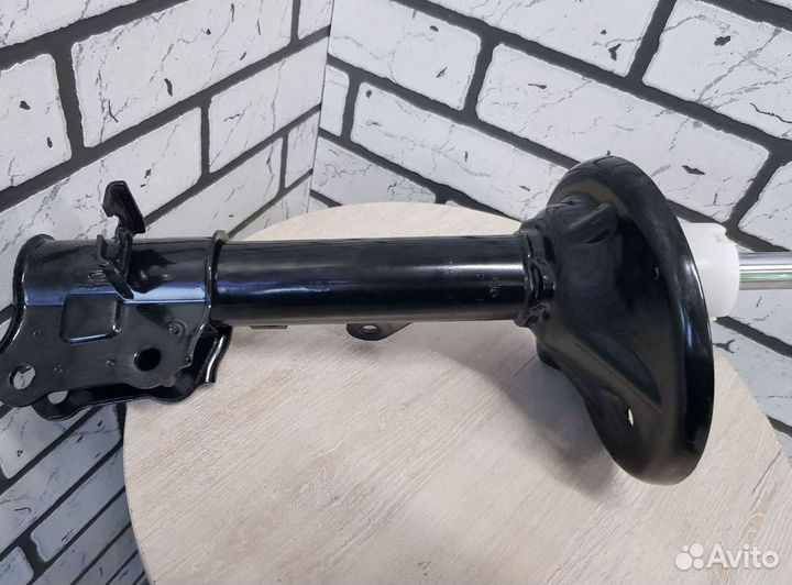 Амортизатор шевроле перед. лев. оригинал