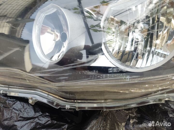 Левая передняя фара lancer 10