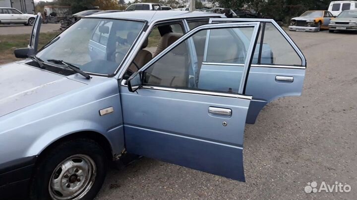 Дверь nissan sunny b11