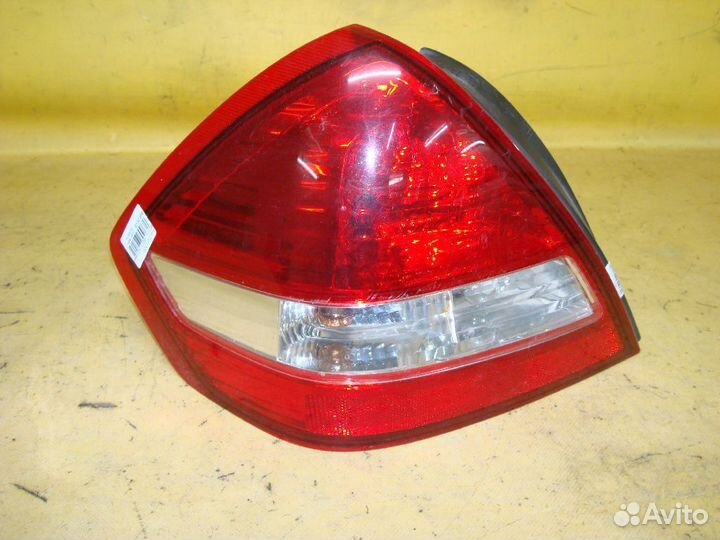 Фонарь левый Nissan Tiida latio SC11