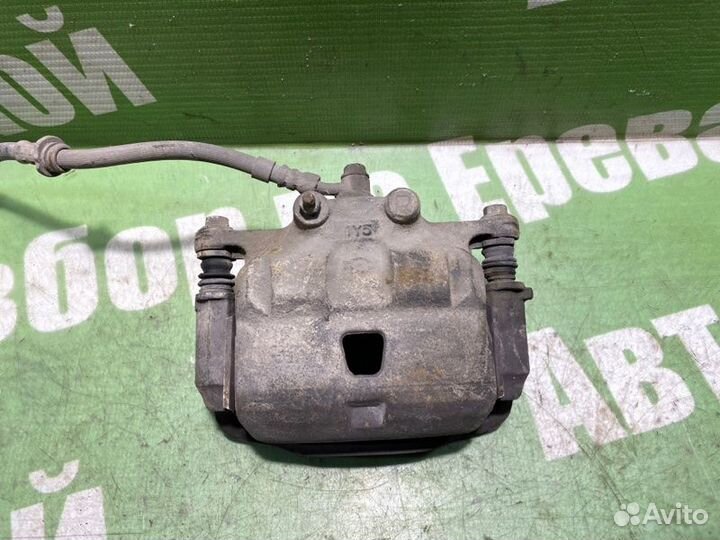 Суппорт тормозной передний правый Nissan March K11