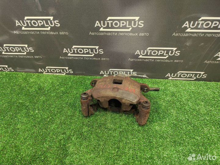 Суппорт передний левый Mitsubishi Lancer X седан