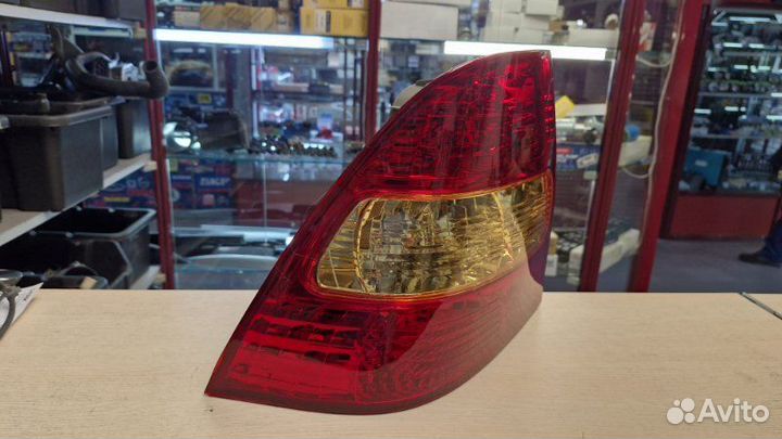 Фонарь задний задний левый Toyota Corolla NZE121