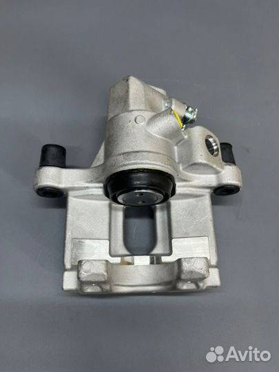 Суппорт тормозной задний левый Ford Focus 2