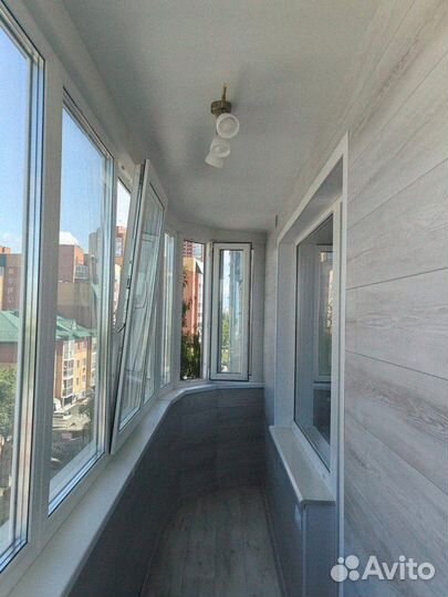 Остекление балкона с отделкой