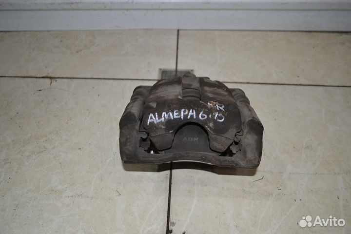 Тормозной суппорт передний правый Nissan Almera G1