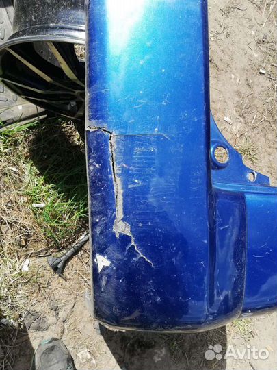 Бампер задний Мазда Демио 1